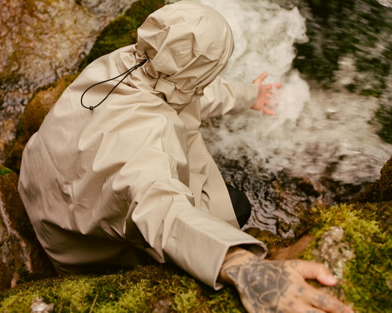 Person exploring the outdoors wearing a shell poncho from BLÆST