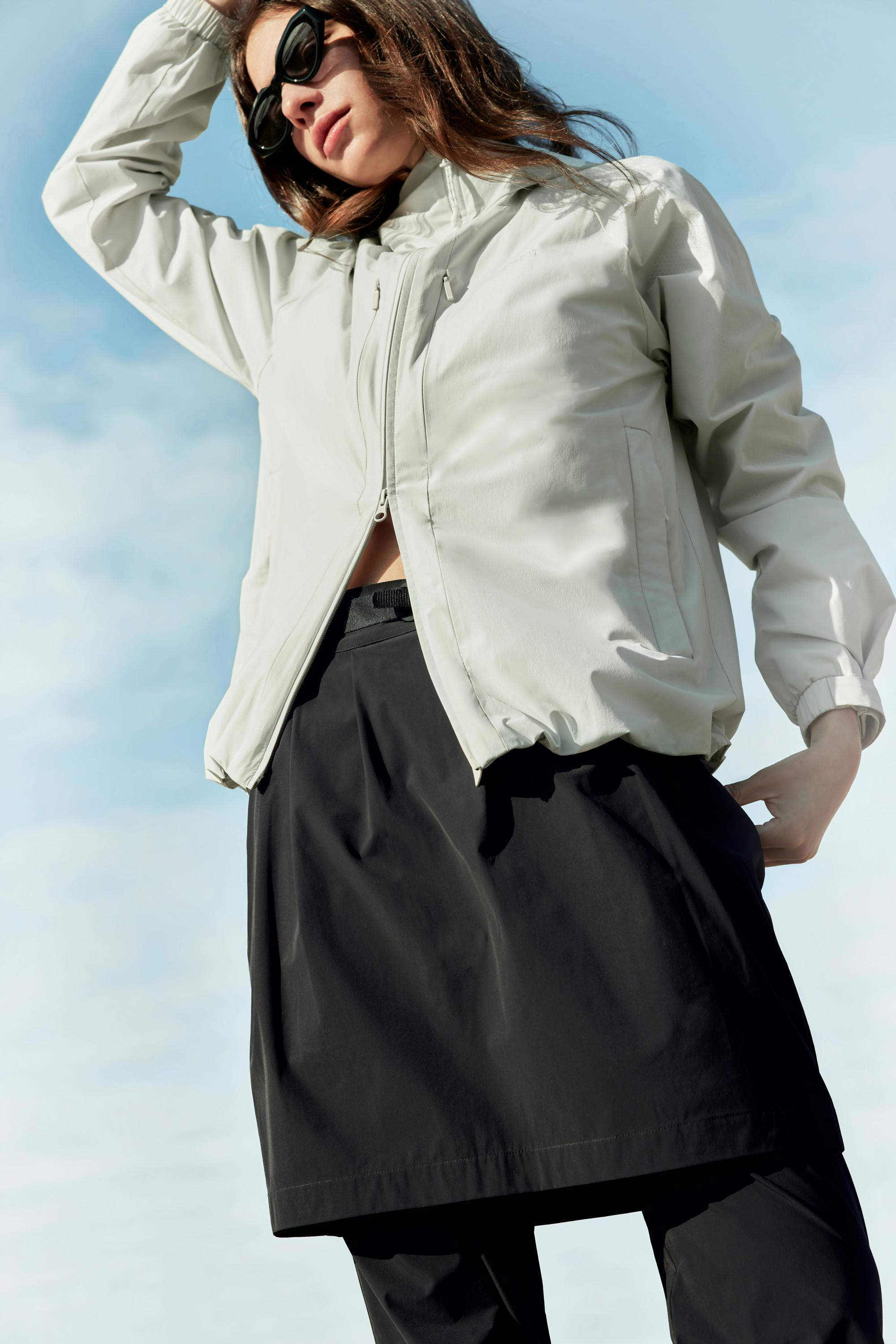 Woman wearing the Hjelle lightweight jacket and skirt from BLÆST