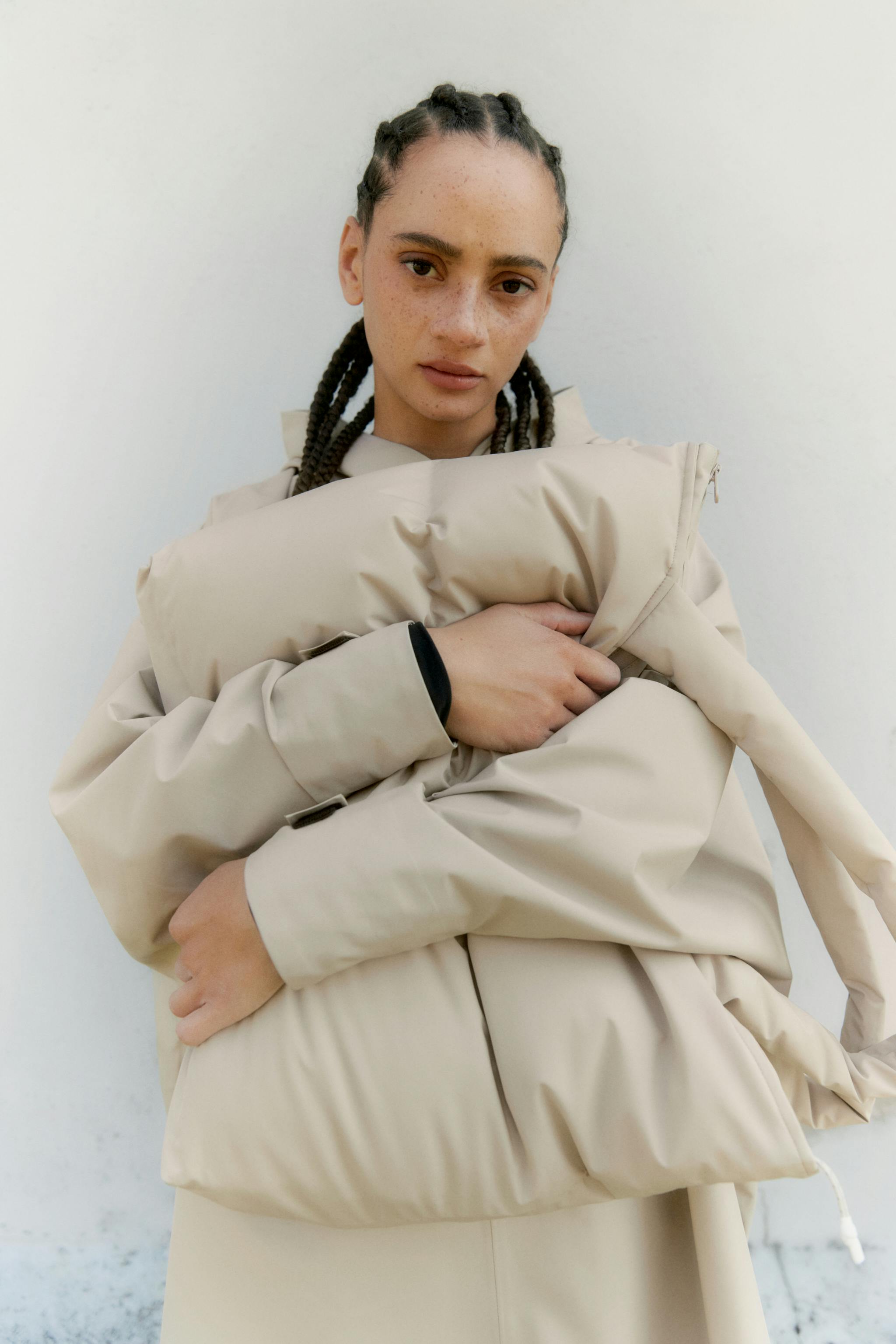 Woman holding a beige pillow bag from BLÆST