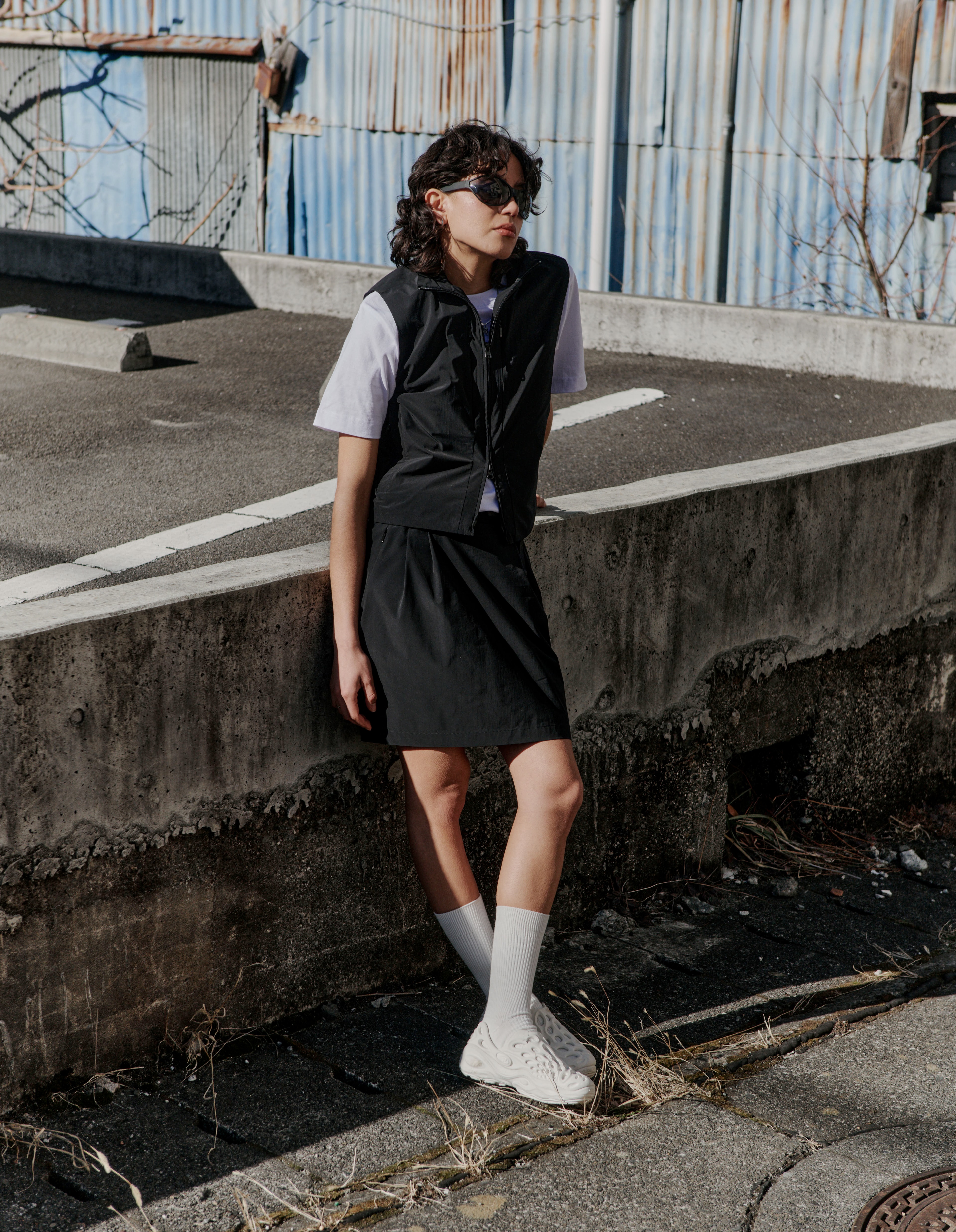 Woman wearing the Hjelle lightweight vest and skirt from BLÆSt