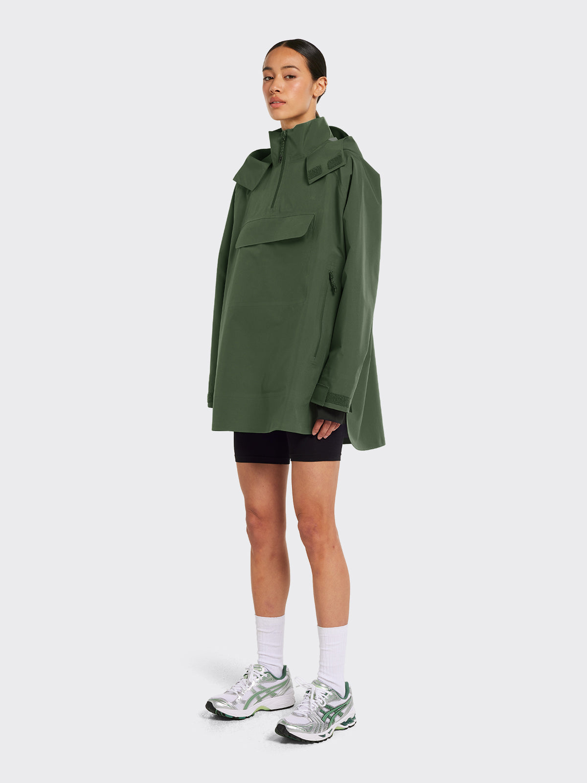 Woman wearing Voss poncho in Dusty Green from Blæst