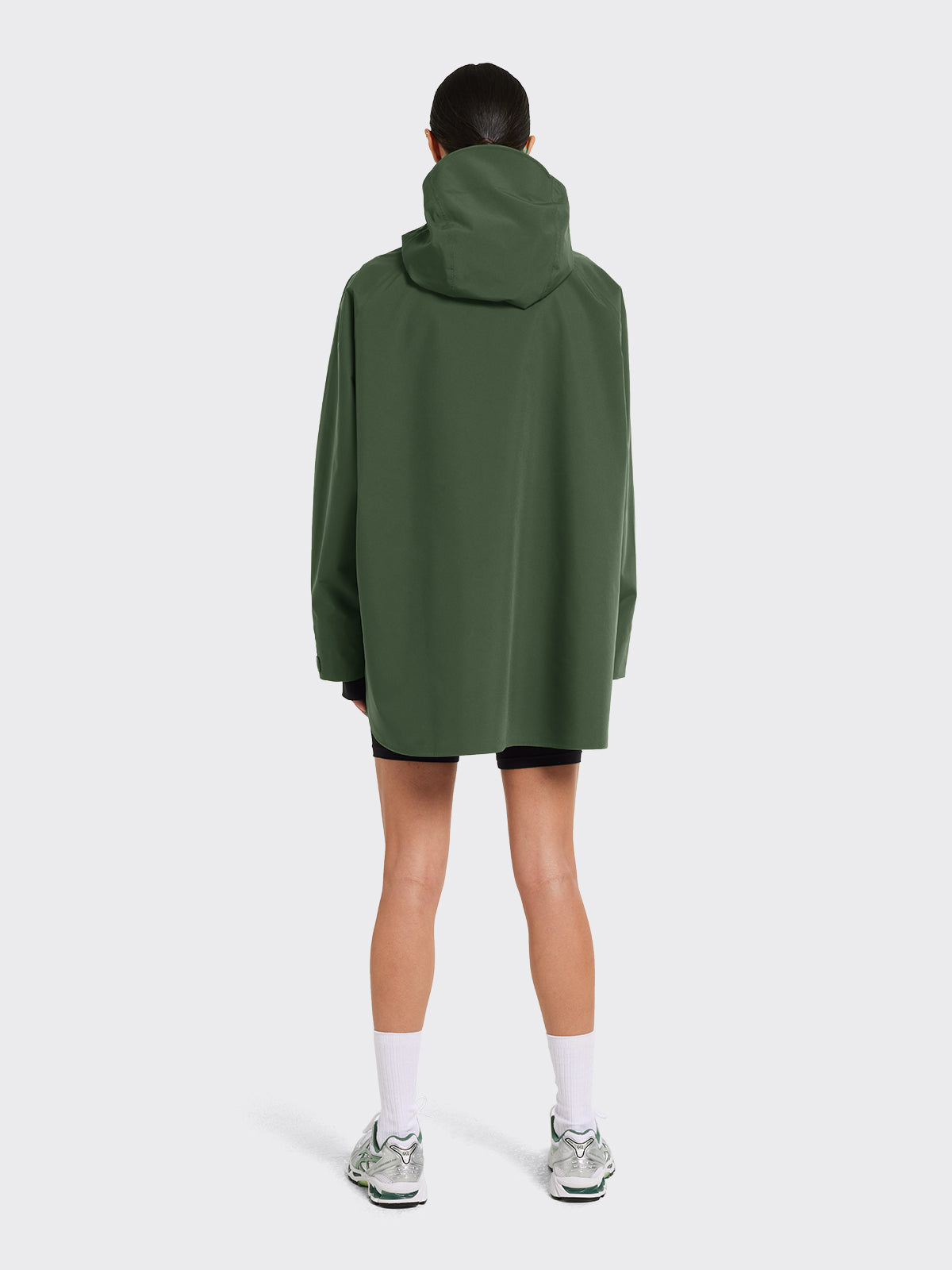 Woman in Voss poncho in Dusty Green by Blæst