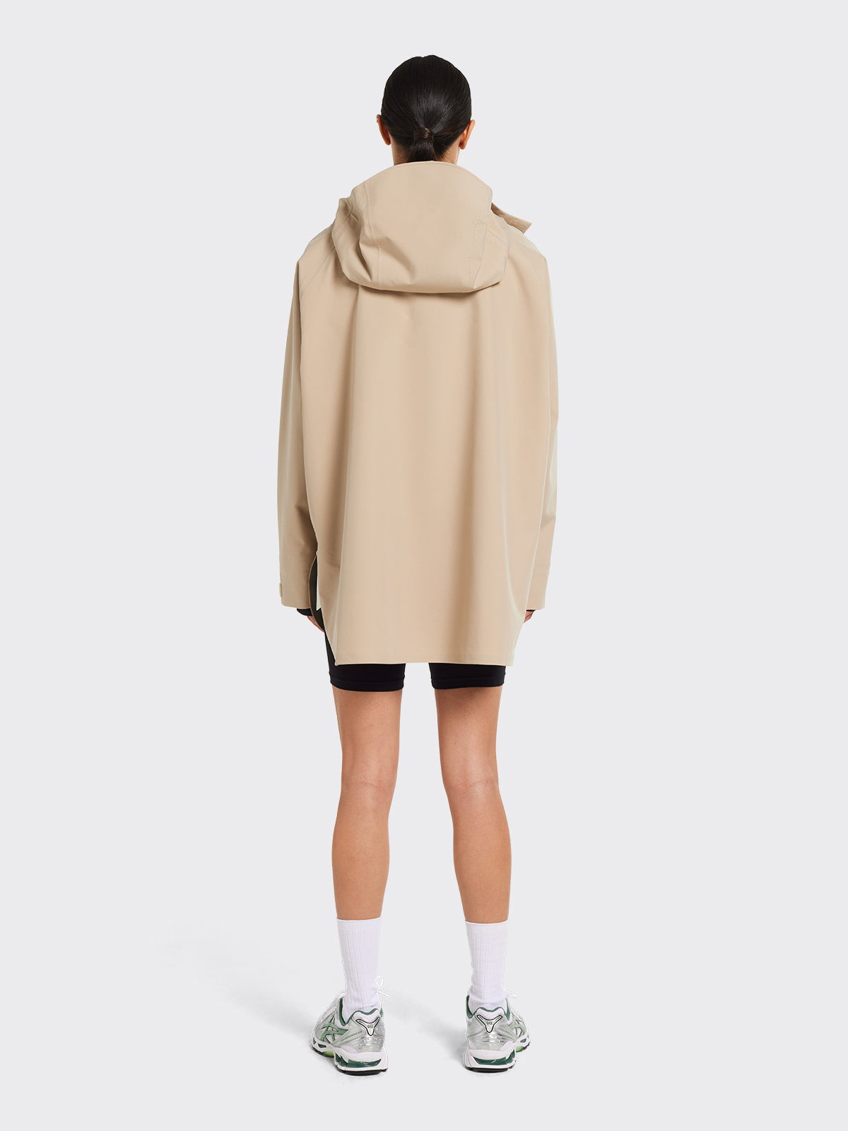 Woman in Voss poncho from Blæst in Beige